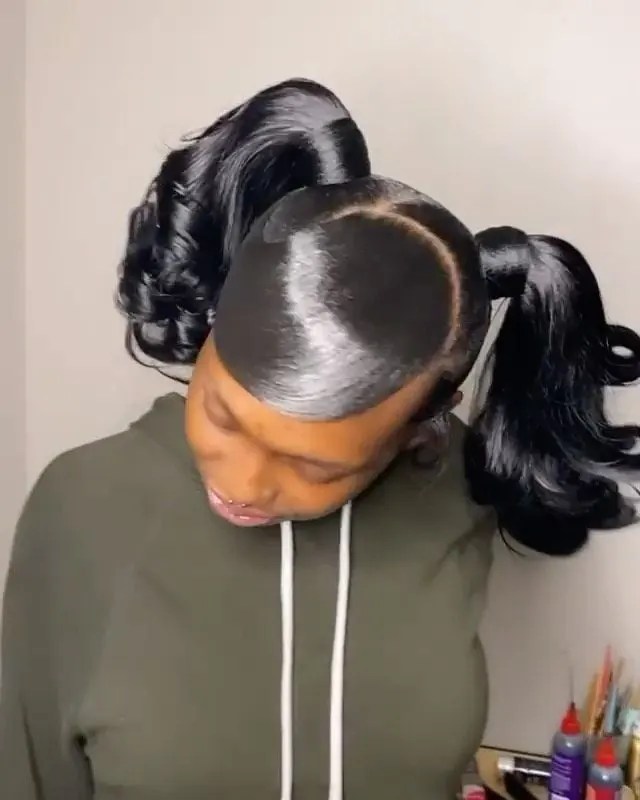 lady wearing heavily gelled double ponytails
