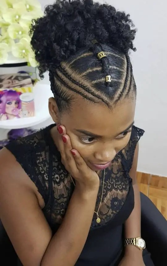 lady wearing afro ponytail with hand on her chin