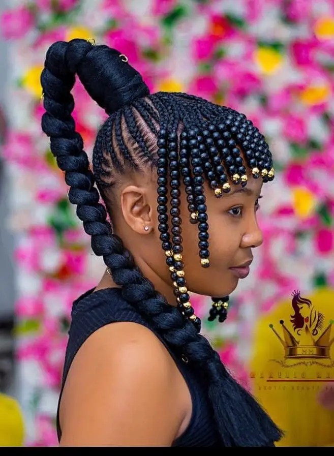 lady wearing braided ponytail with beads
