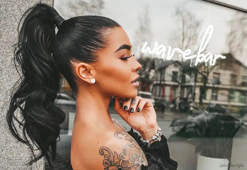 Tattooed lady wearing high ponytail hairstyle