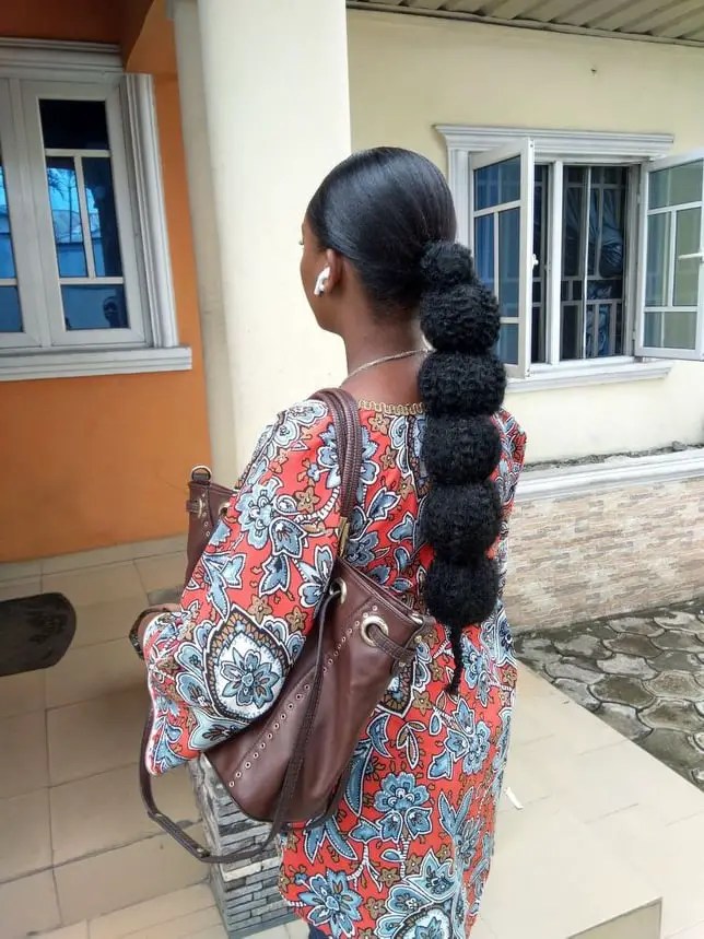 lady rocking knotted low ponytail