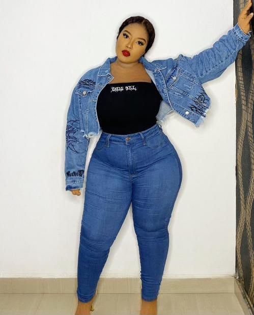 fair plus-size lady in a high-waist jean