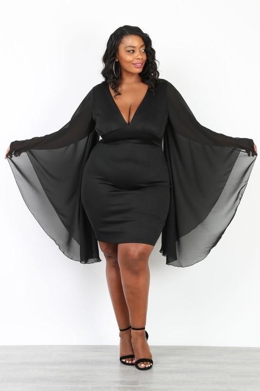 lady in a black butterfly dress - Outfits for Ladies with Big Belly