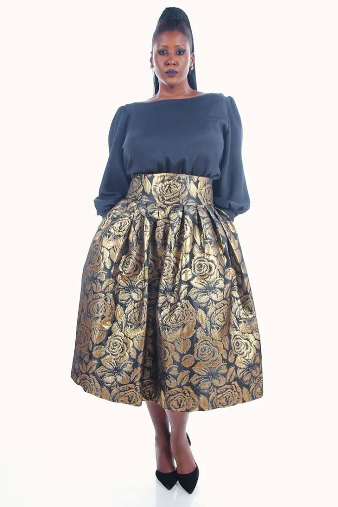 African lady in an animal print flare skirt