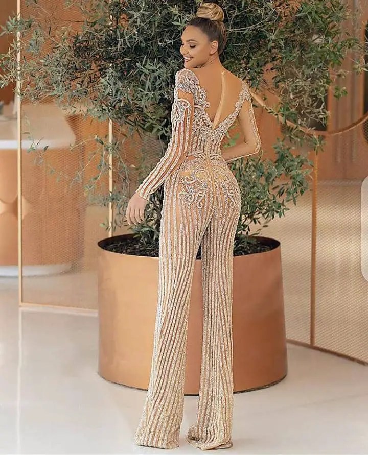 lady wearing jumpsuit made with lace material