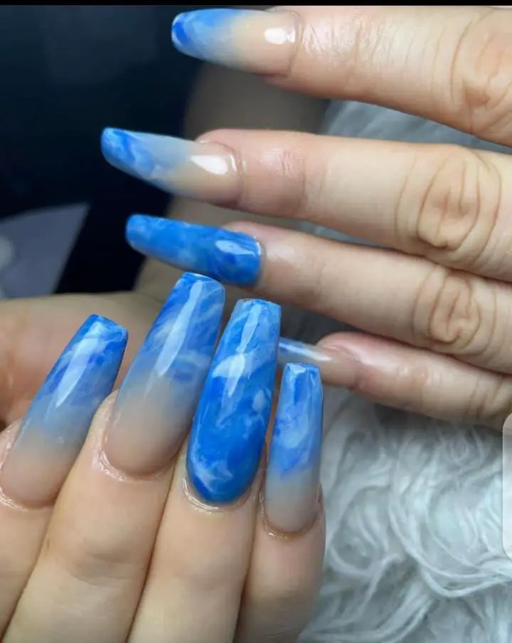 blue design nails on fingers