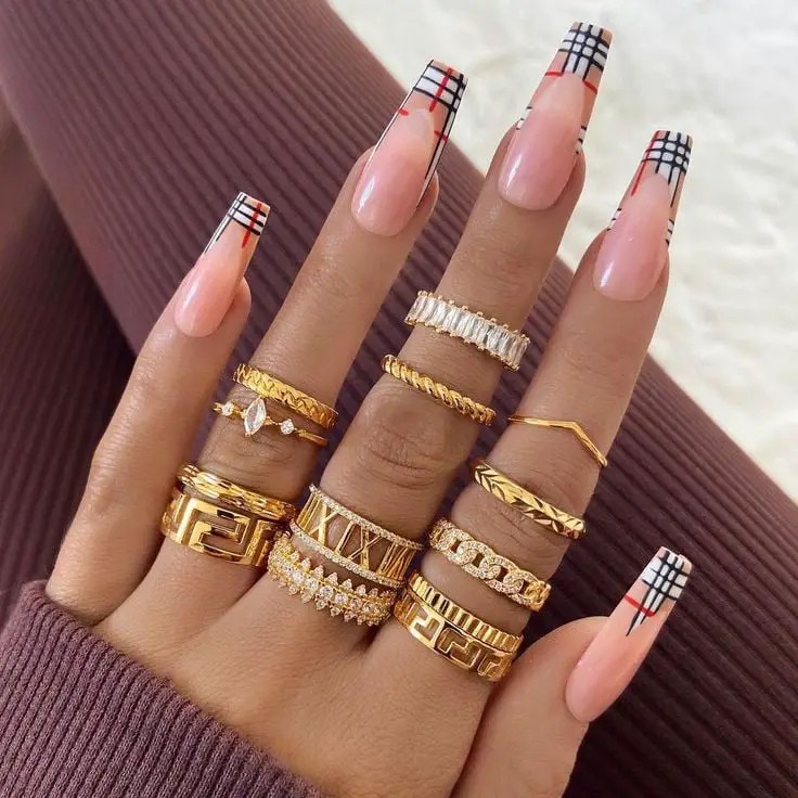 fashion nails on fingers with many rings