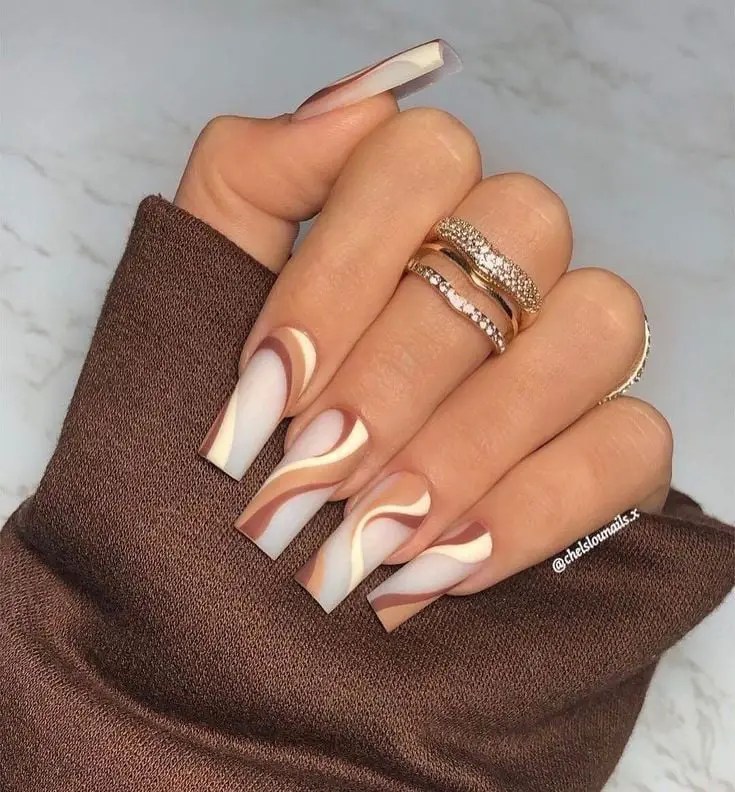 acrylic fashion nails on fingers with a ring