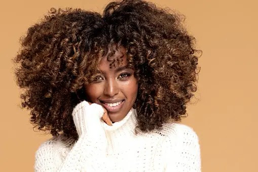 pretty lady rocking brown afro hairstyle