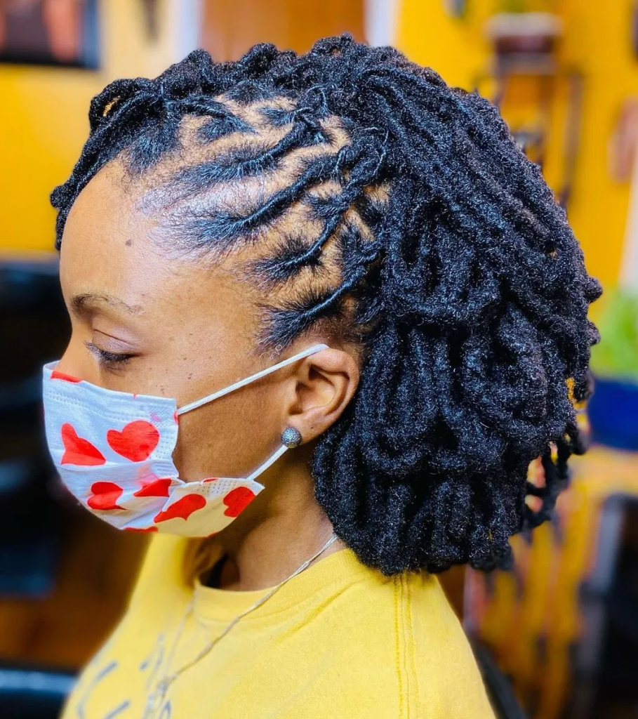 lady wearing black dreads with facemask