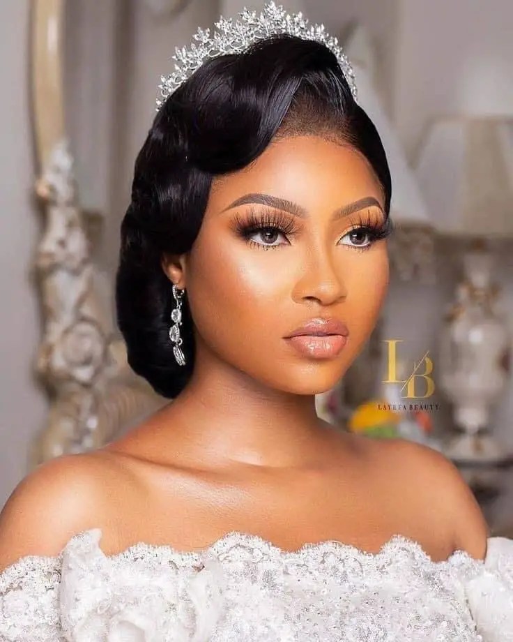 headshot of a bride wearing makeup for her white wedding
