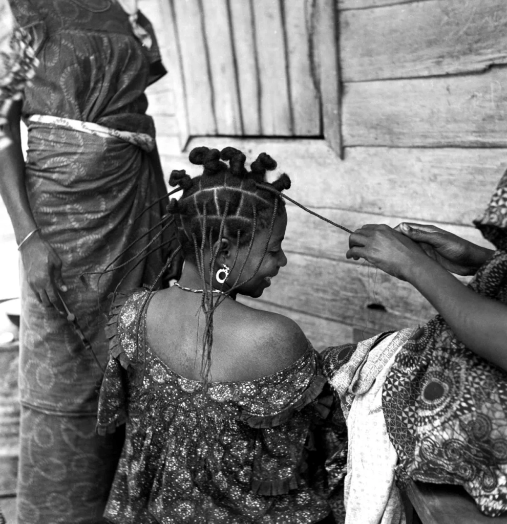 women plaiting thread hairstyle