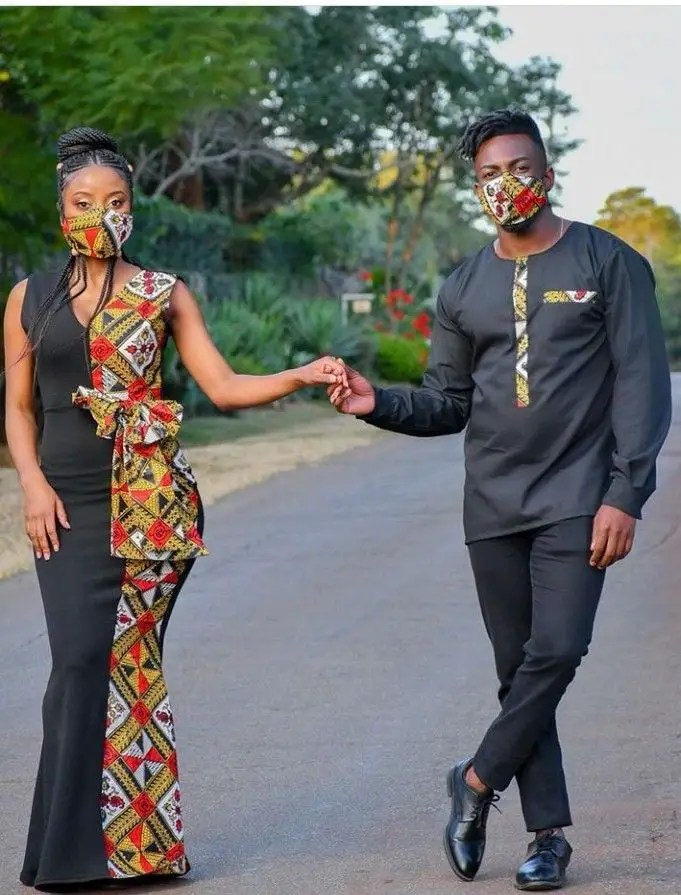 couple rocking touches of matching ankara holding hands on the road
