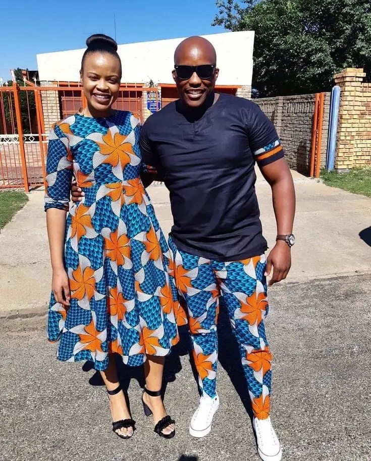 couple wearing matching ankara outfits in the sun