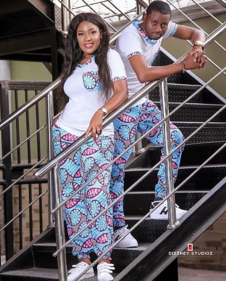 couple wearing matching ankara pants and white T-shirts