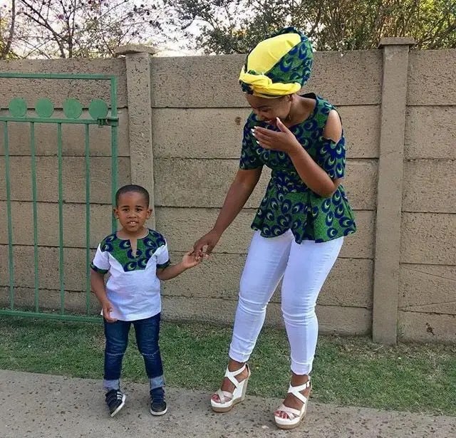 mother and son wearing ankara and jeans outfits