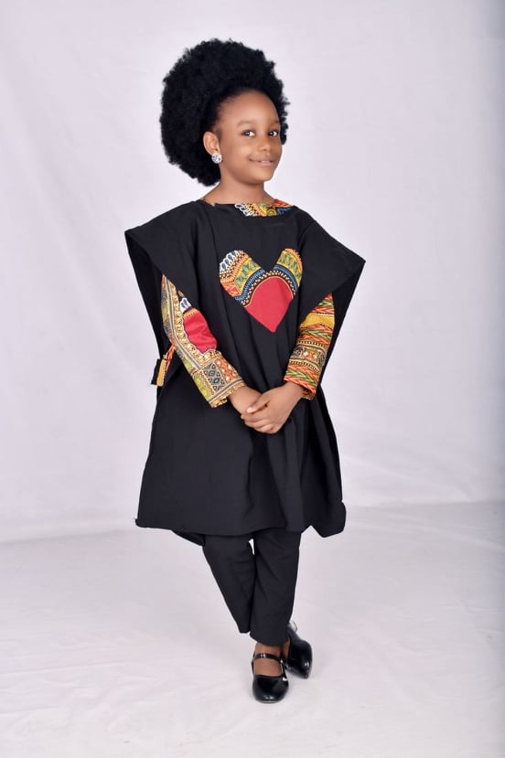 girl wear black agbada with love embroidery in front