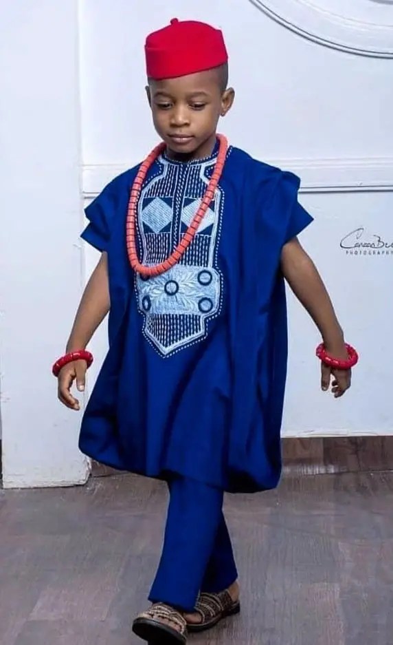 Yoruba boy wearing blue embroidered agbada