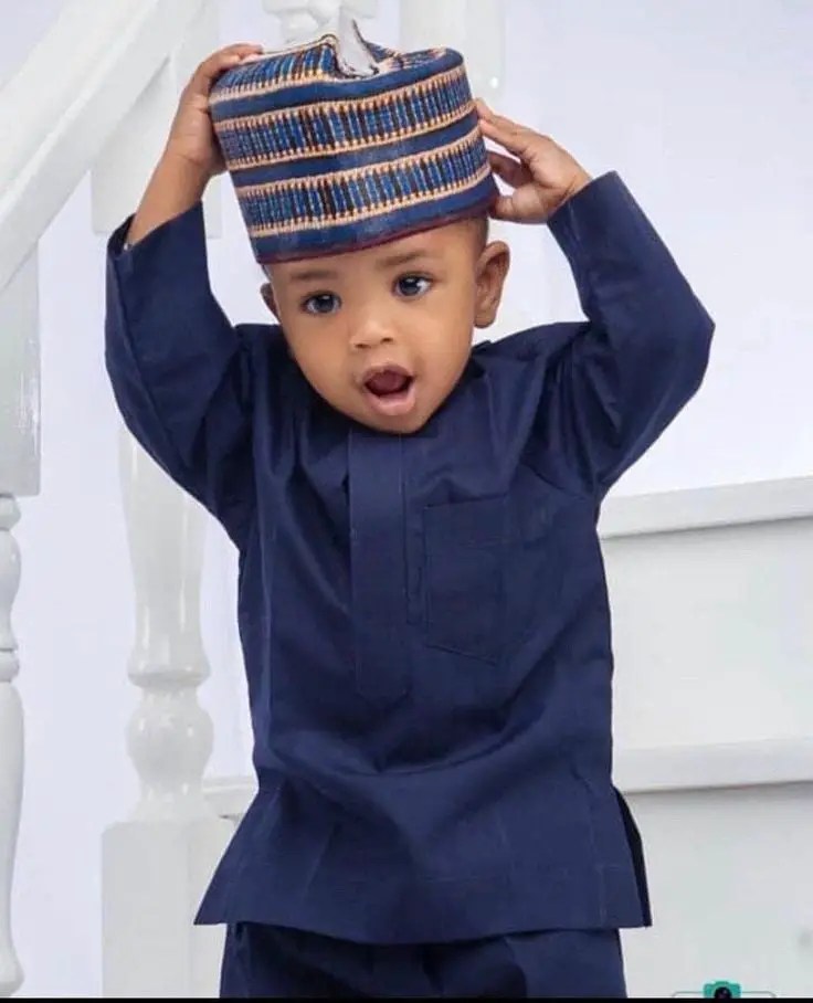 boy wearing kaftan with Hausa cap