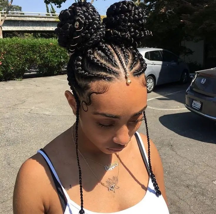 lady rocking double braided buns outside