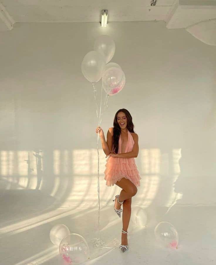 lady taking birthday photoshoot with baloons