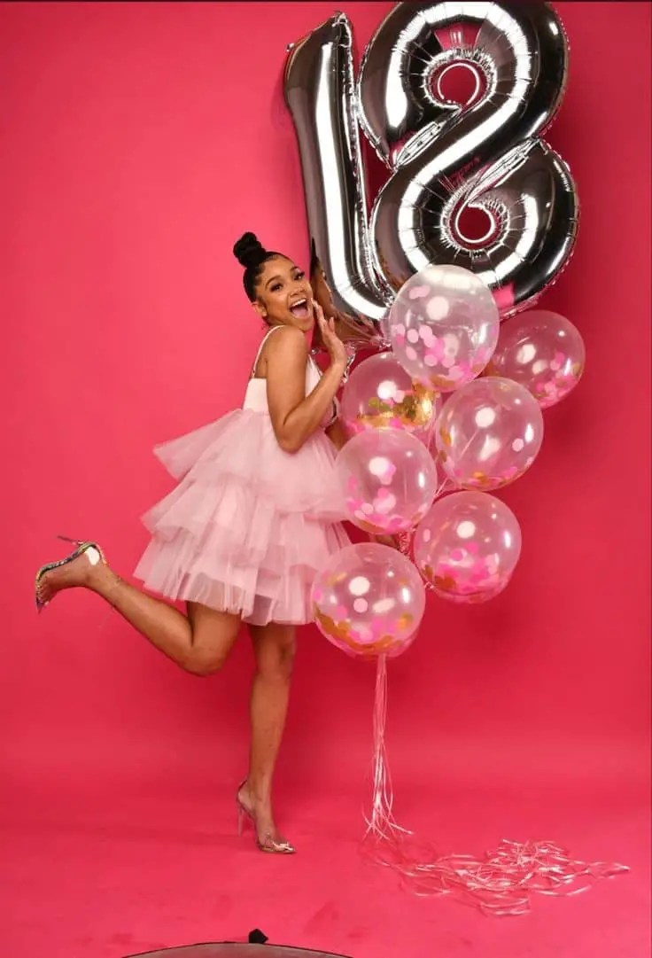 happy 18 year old lady with balloons