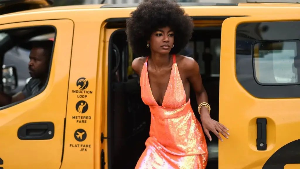 lady alighting from yellow bus