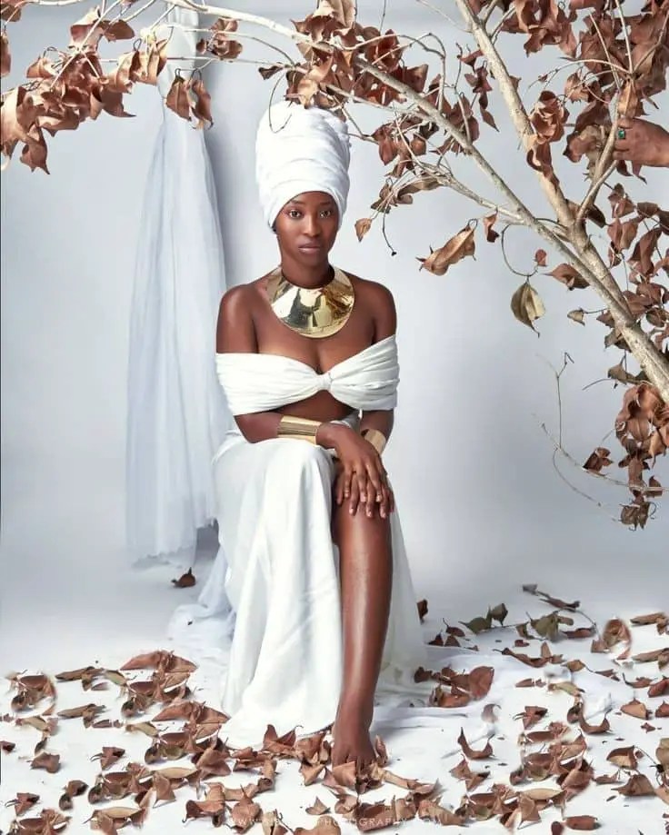 lady wearing white outfit for a birthday photoshoot