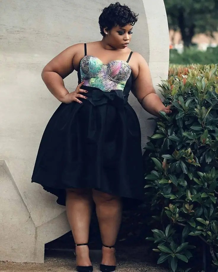 plus sized lady wearing sleeveless ball gown for her birthday photo shoot
