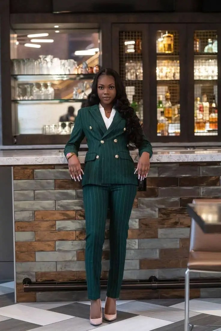 lady wearing suit at a bar