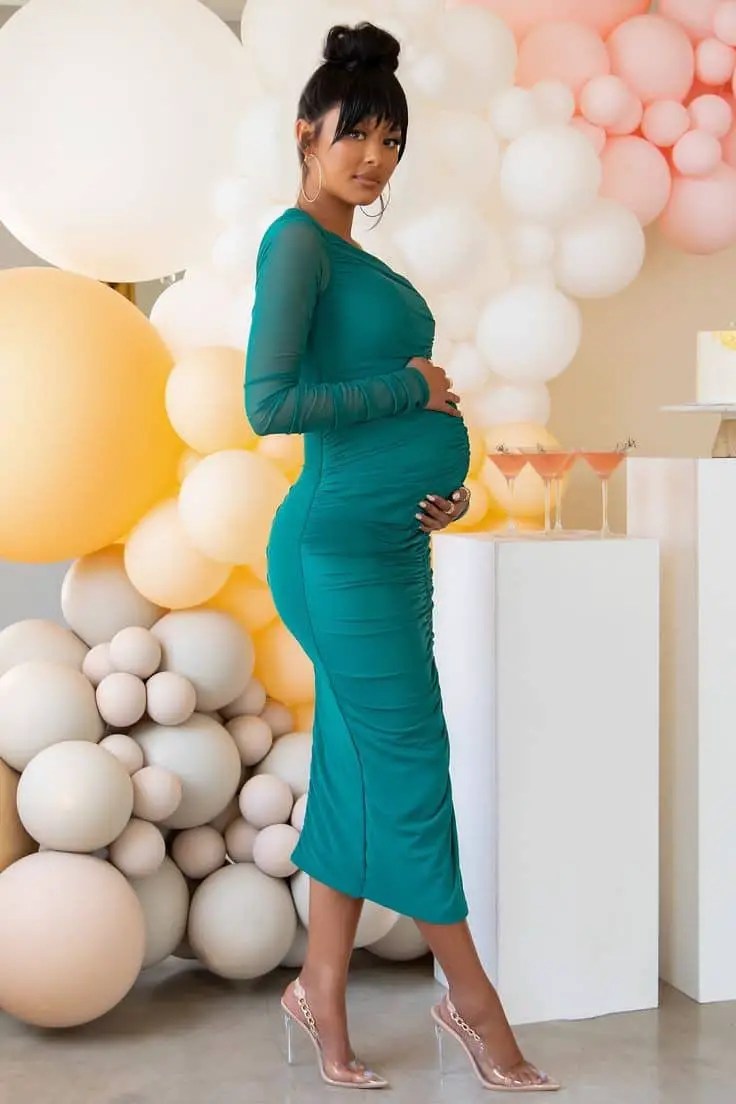 pregnant lady wearing green dress