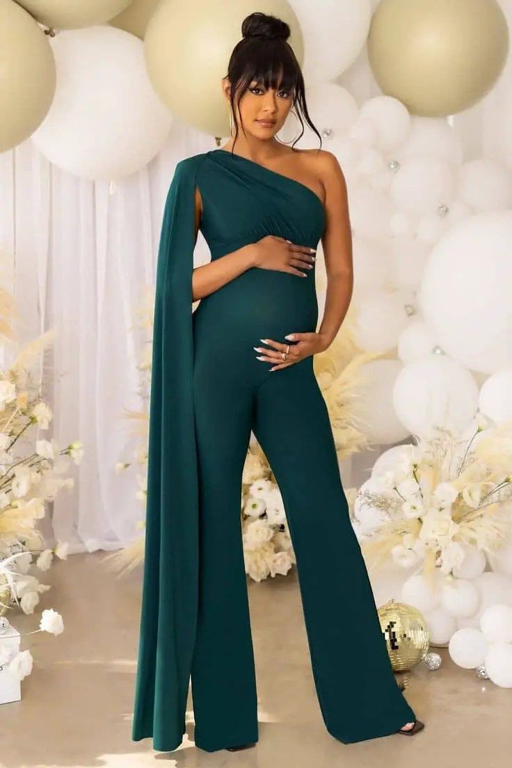 Pregnant woman wearing green maternity jumpsuit