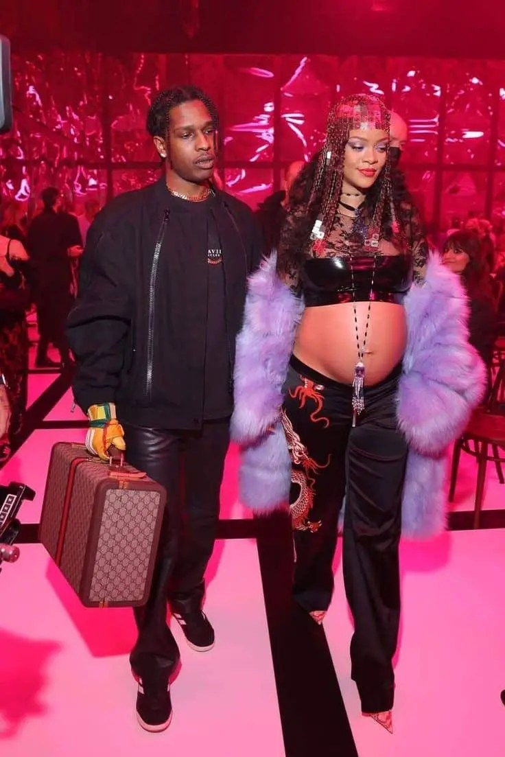 Rihanna and A $ AP Rocky wearing crop tops revealing baby bumps