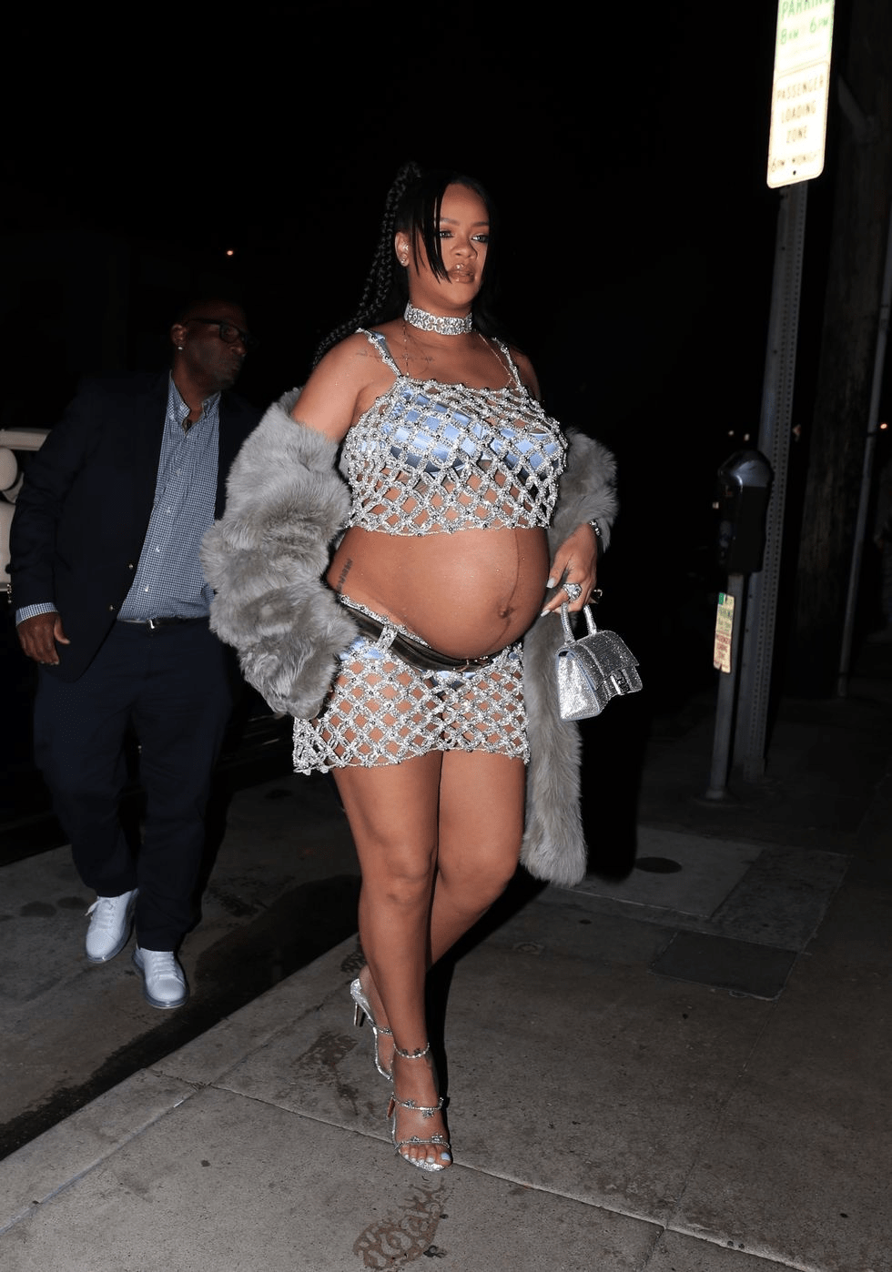 Rihanna rocking sheer crop top and mini skirt while pregnant