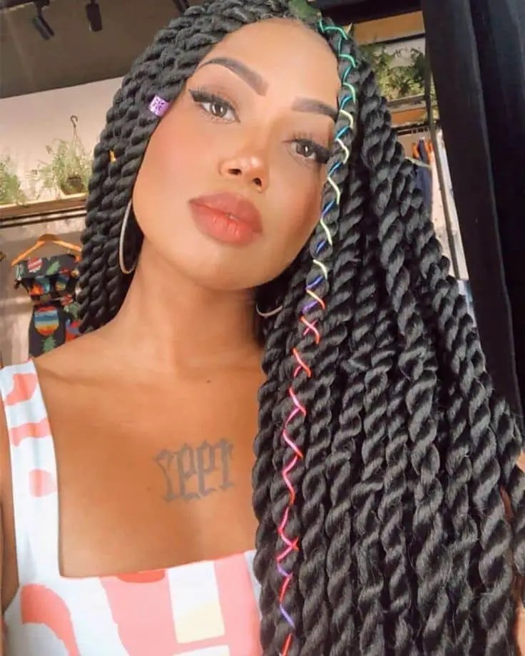 Beautiful woman wearing a long senegalese braid