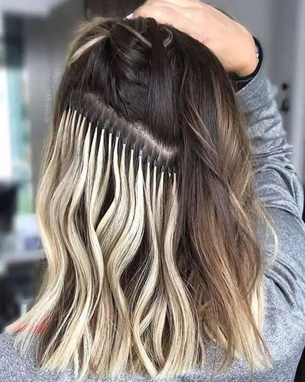 Blonde hair extension on hair