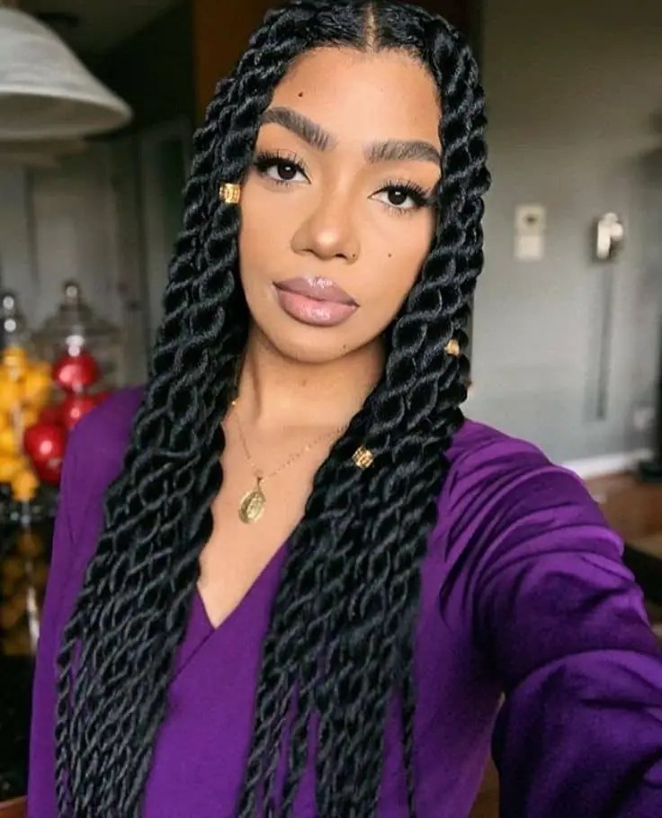 Pretty woman wearing a long black senegalese braid