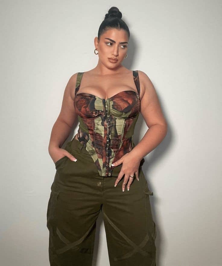 Woman wearing combat uniform in corset