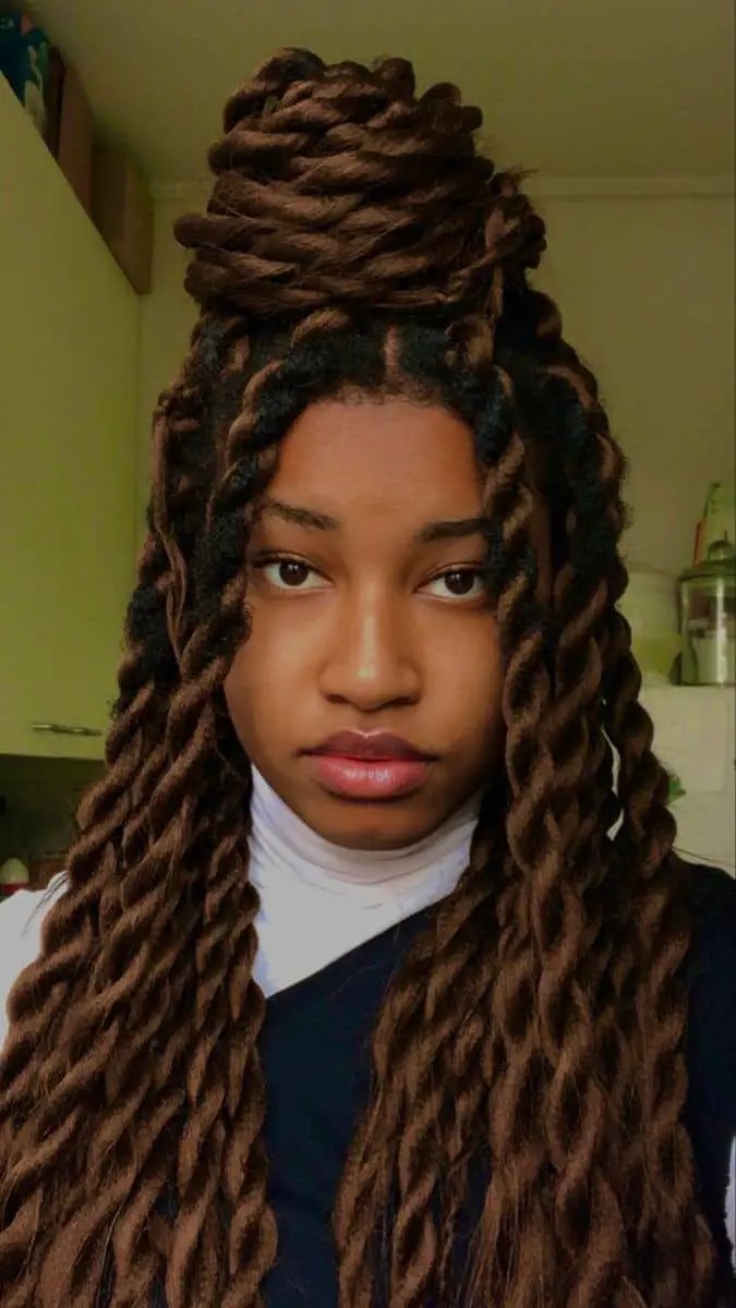 A fine woman wearing a thick Senegalese braid