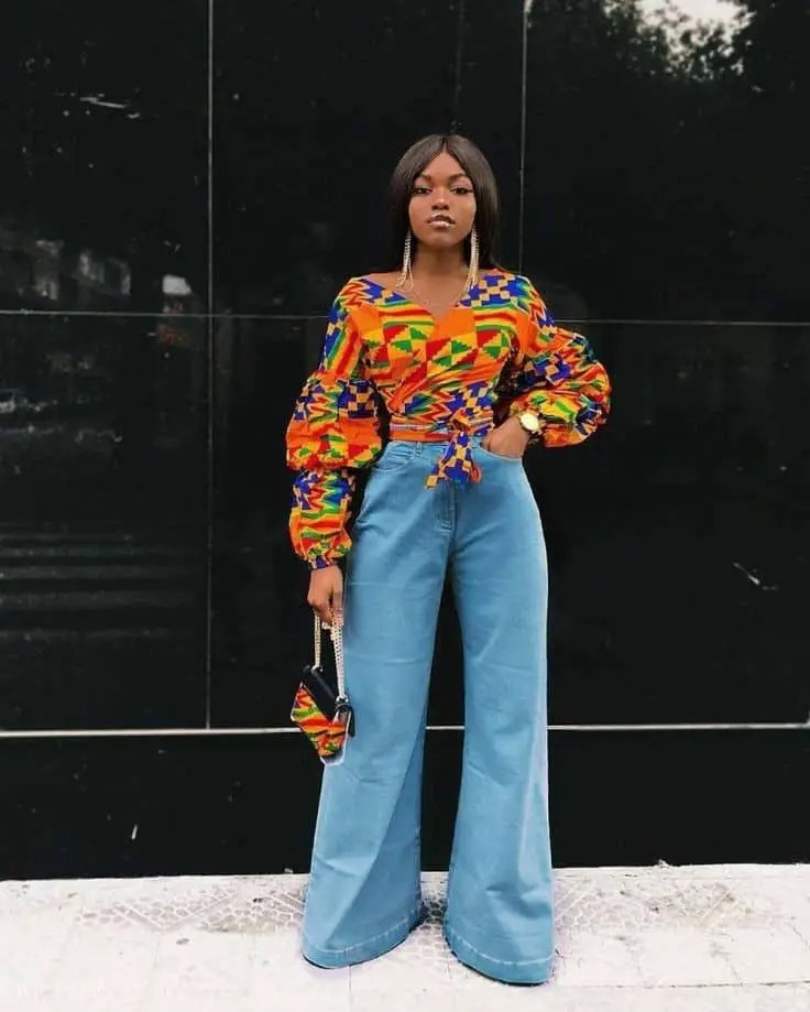 Woman wearing jeans and Kente top