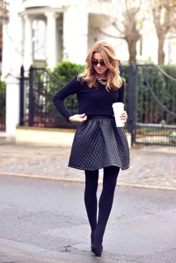 lady in dark shades wearing leggings under polka dots flared skirt