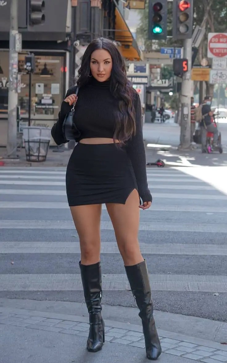 Woman wearing a black top and a black miniskirt