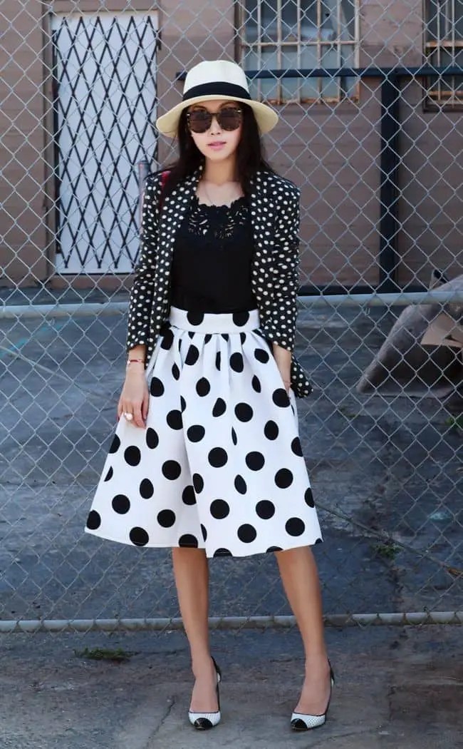 lady wearing mixed print outfit with flared skirt