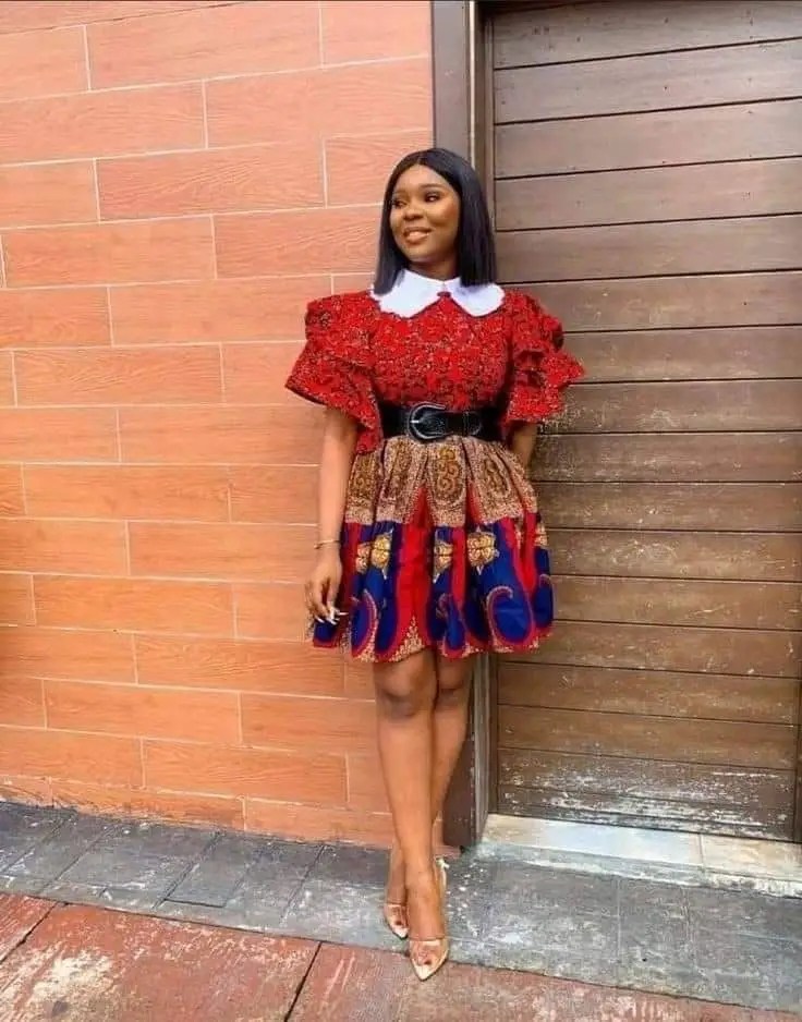 lady wearing mixed print ankara outfit with flared skirt