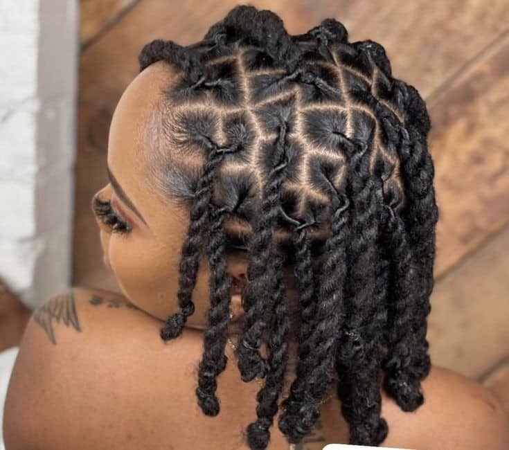A woman wearing a natural Senegalese twist