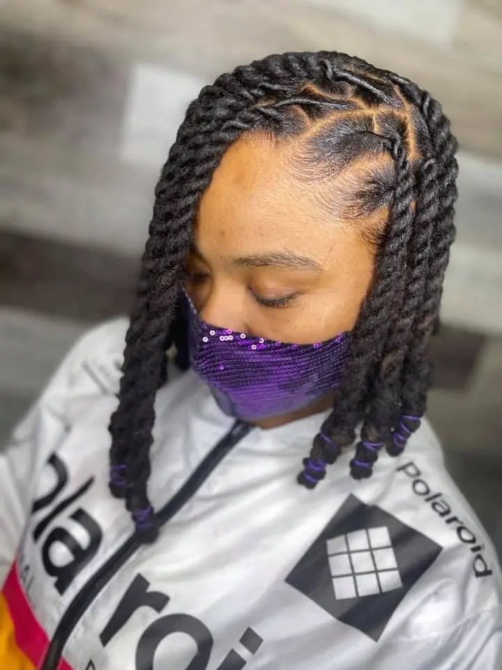 A woman wearing a genuine natural Senegalese twist