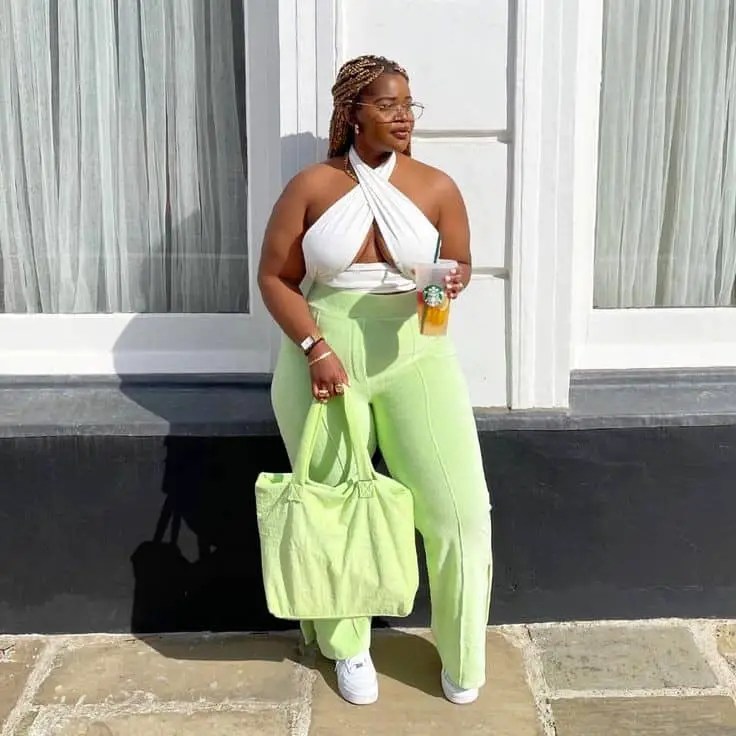 A woman wearing a lemon Palazzo and a white top
