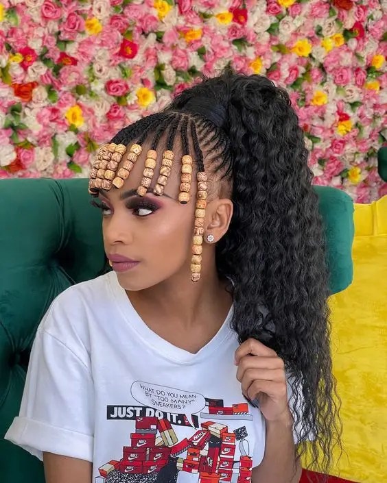 Woman wearing beads and Fulani braids