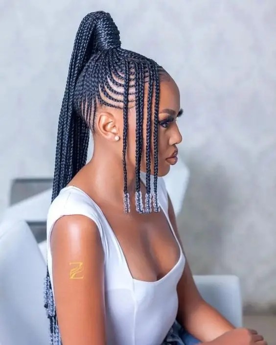 Woman rocking beaded Fulani in white top