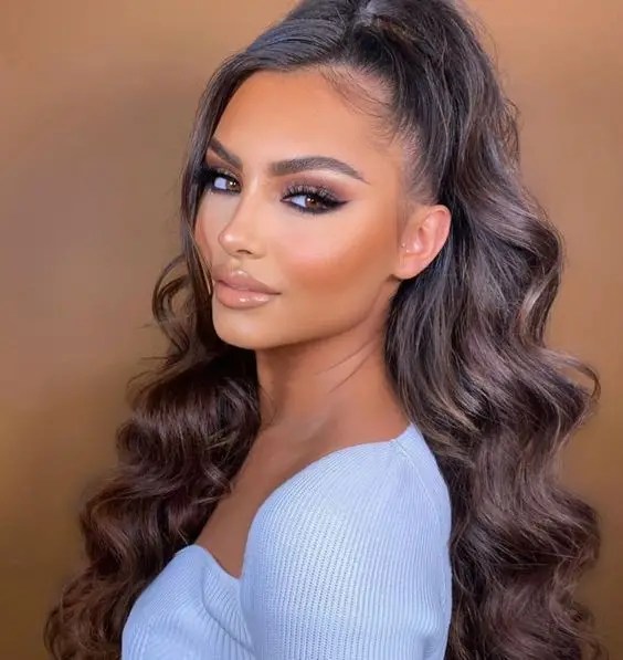 Side view of woman rocking long hairstyle